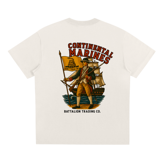 White t-shirt with a colorful graphic of a soldier and ship, featuring 'Continental Marines' text, on a white background.